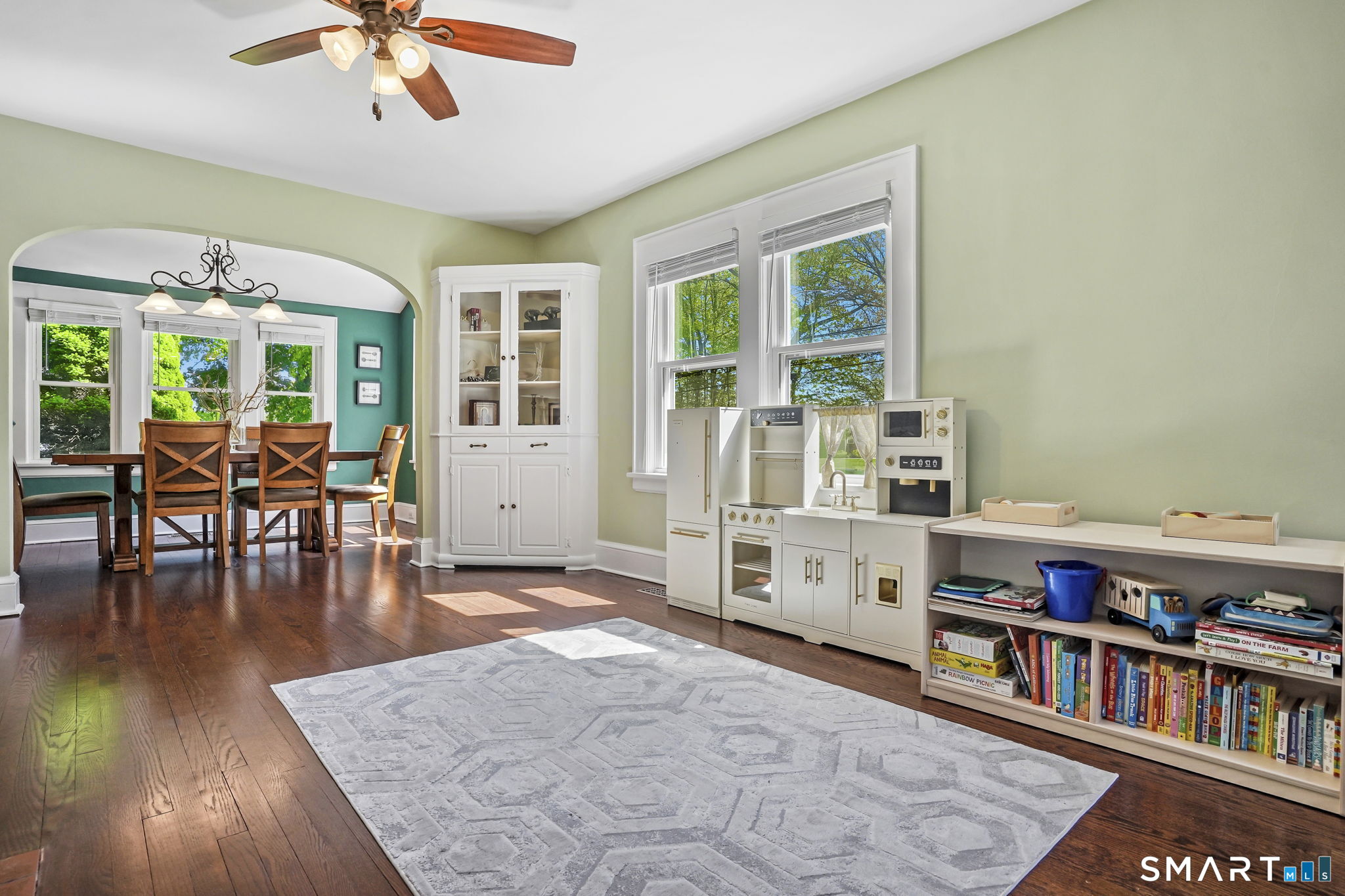 315 Church Hill Road Trumbull, CT 06611 - Photo 8 of 40 a living room with furniture and a book shelf