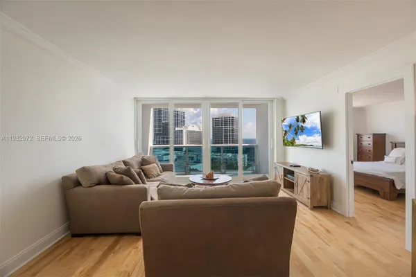 a living room with furniture and a window