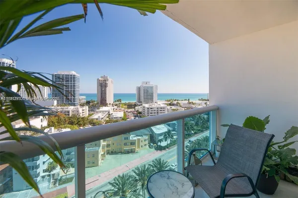 a view of a balcony with furniture