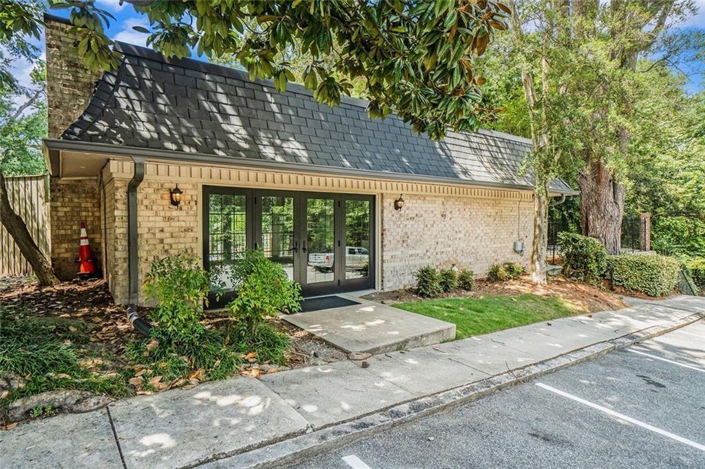 94 Rosaire Place Northwest Atlanta, GA 30327 - Photo 15 of 21 a front view of a house with garden
