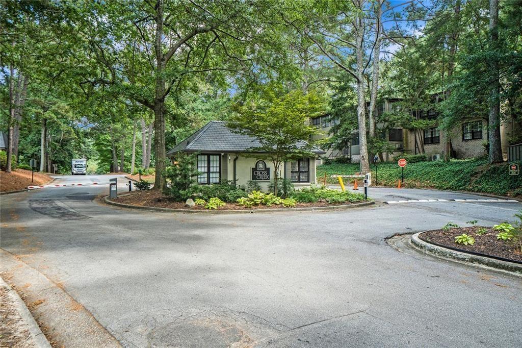 94 Rosaire Place Northwest Atlanta, GA 30327 - Photo 16 of 21 a front view of a house with a yard and trees