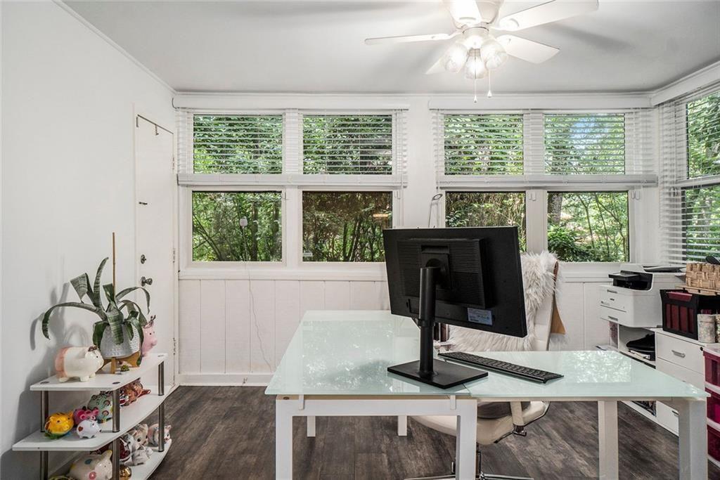 94 Rosaire Place Northwest Atlanta, GA 30327 - Photo 2 of 21 a living room with furniture and a floor to ceiling window