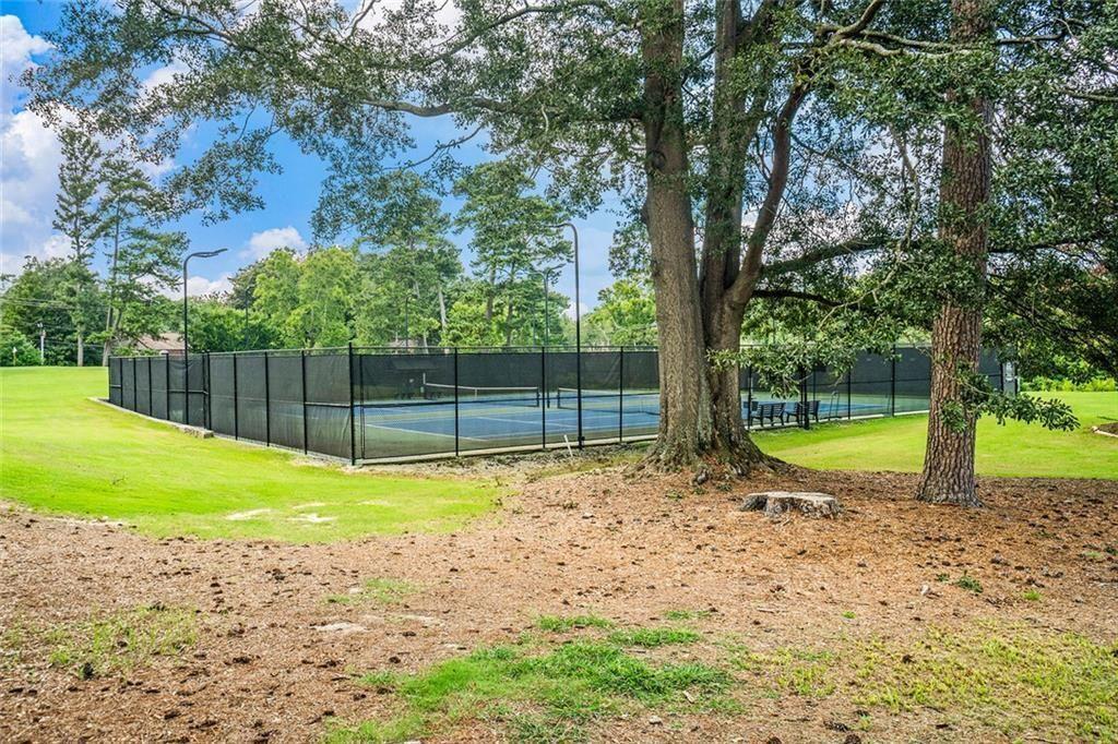 94 Rosaire Place Northwest Atlanta, GA 30327 - Photo 21 of 21 a view of a swimming pool with a backyard
