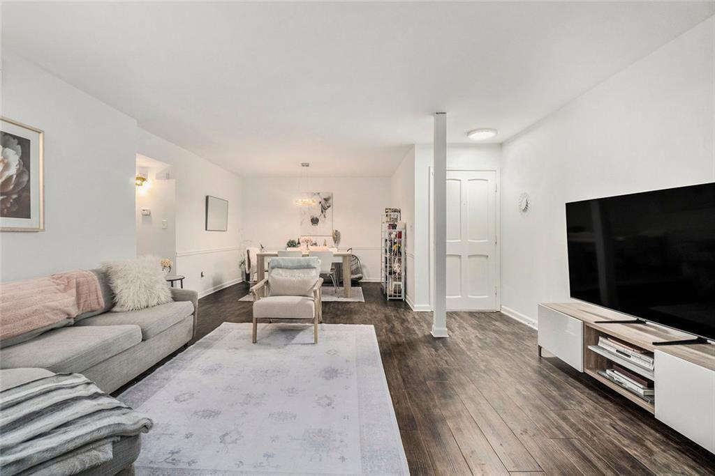 94 Rosaire Place Northwest Atlanta, GA 30327 - Photo 3 of 21 a living room with furniture and a flat screen tv