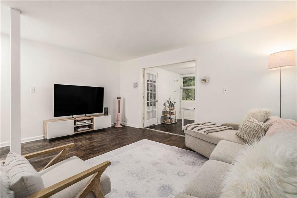 94 Rosaire Place Northwest Atlanta, GA 30327 - Photo 5 of 21 a living room with furniture and a flat screen tv