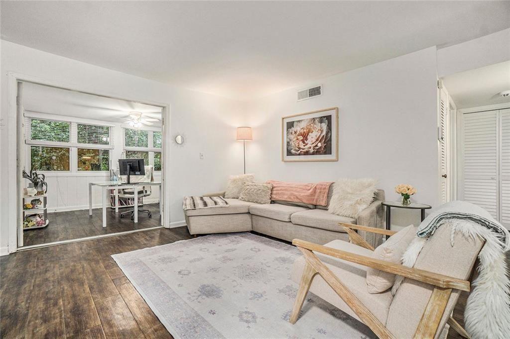 94 Rosaire Place Northwest Atlanta, GA 30327 - Photo 6 of 21 a living room with furniture and a flat screen tv