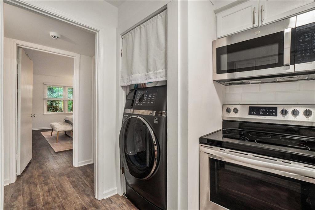 94 Rosaire Place Northwest Atlanta, GA 30327 - Photo 7 of 21 a kitchen with a stove and a microwave