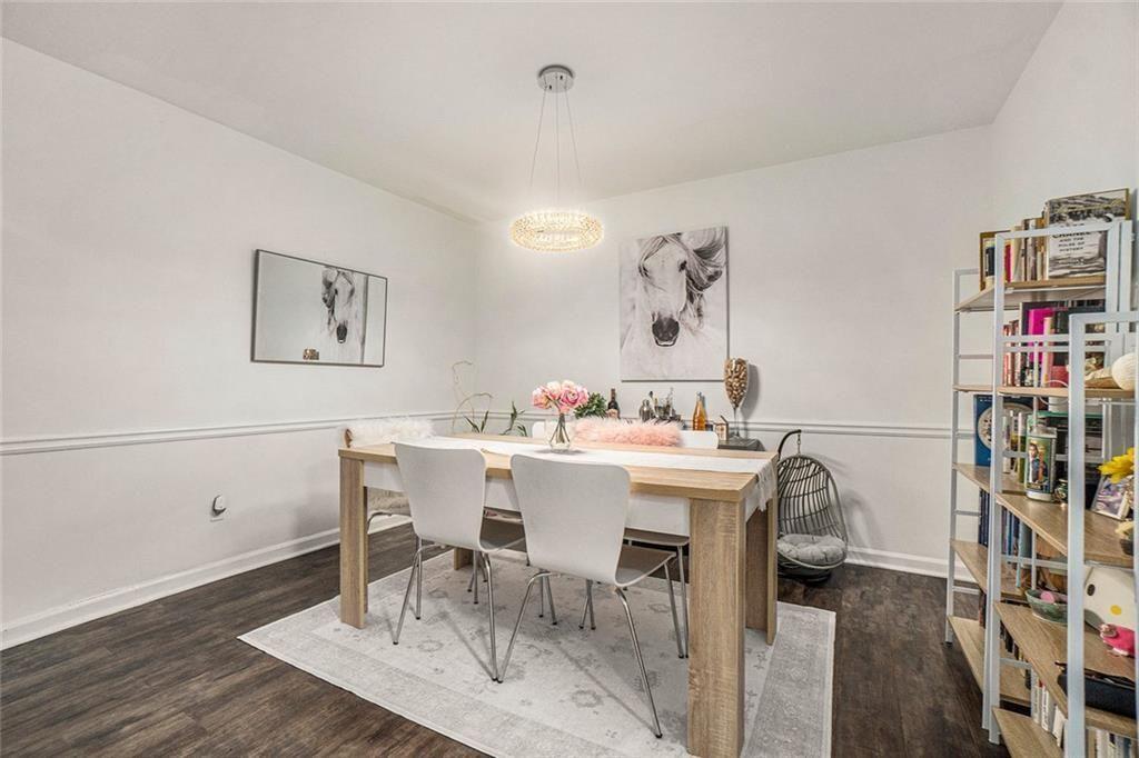 94 Rosaire Place Northwest Atlanta, GA 30327 - Photo 8 of 21 a view of a dining room with furniture and wooden floor