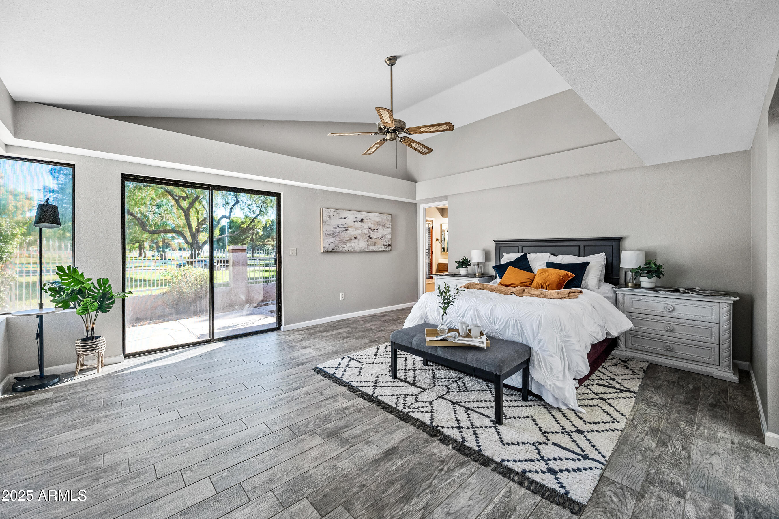 5751 West Del Rio Street Chandler, AZ 85226 - Photo 19 of 44 a bedroom with a bed and wooden floor