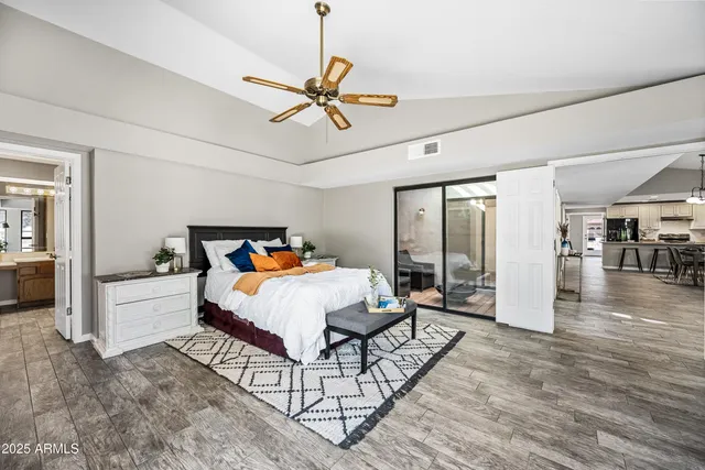 a large bathroom with a large tub sink shower and view
