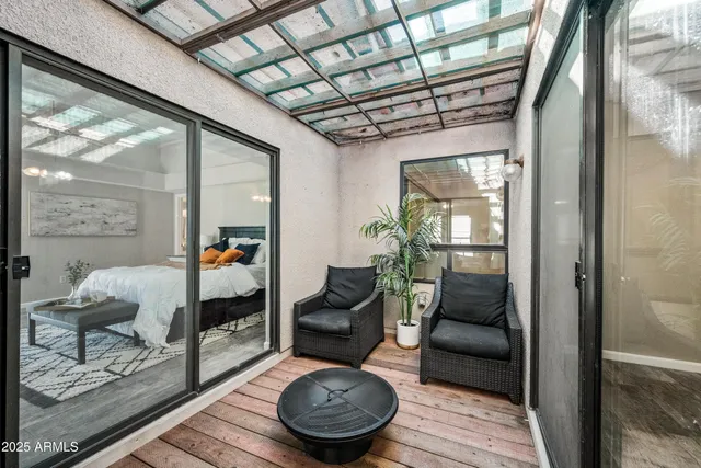 a view of an empty room and glass door