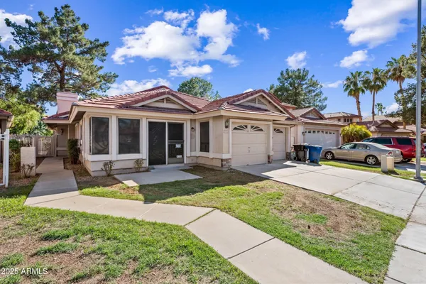 a front view of a house with garden and porch