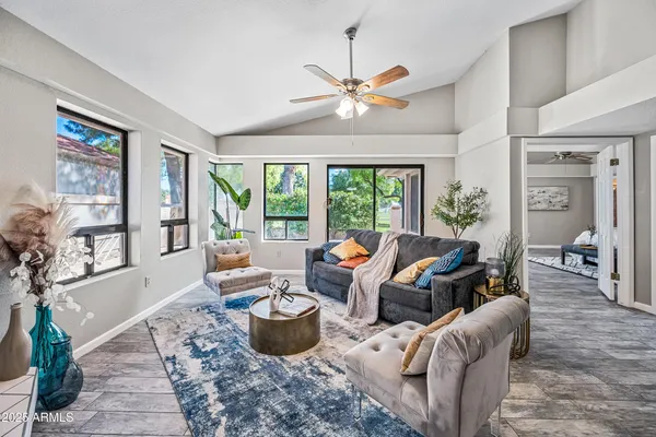 a living room with furniture and a fireplace