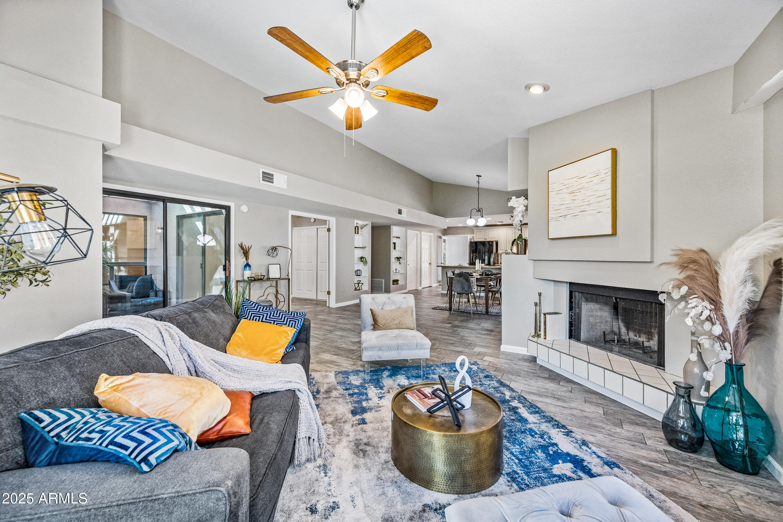 5751 West Del Rio Street Chandler, AZ 85226 - Photo 36 of 44 a living room with furniture and a fireplace