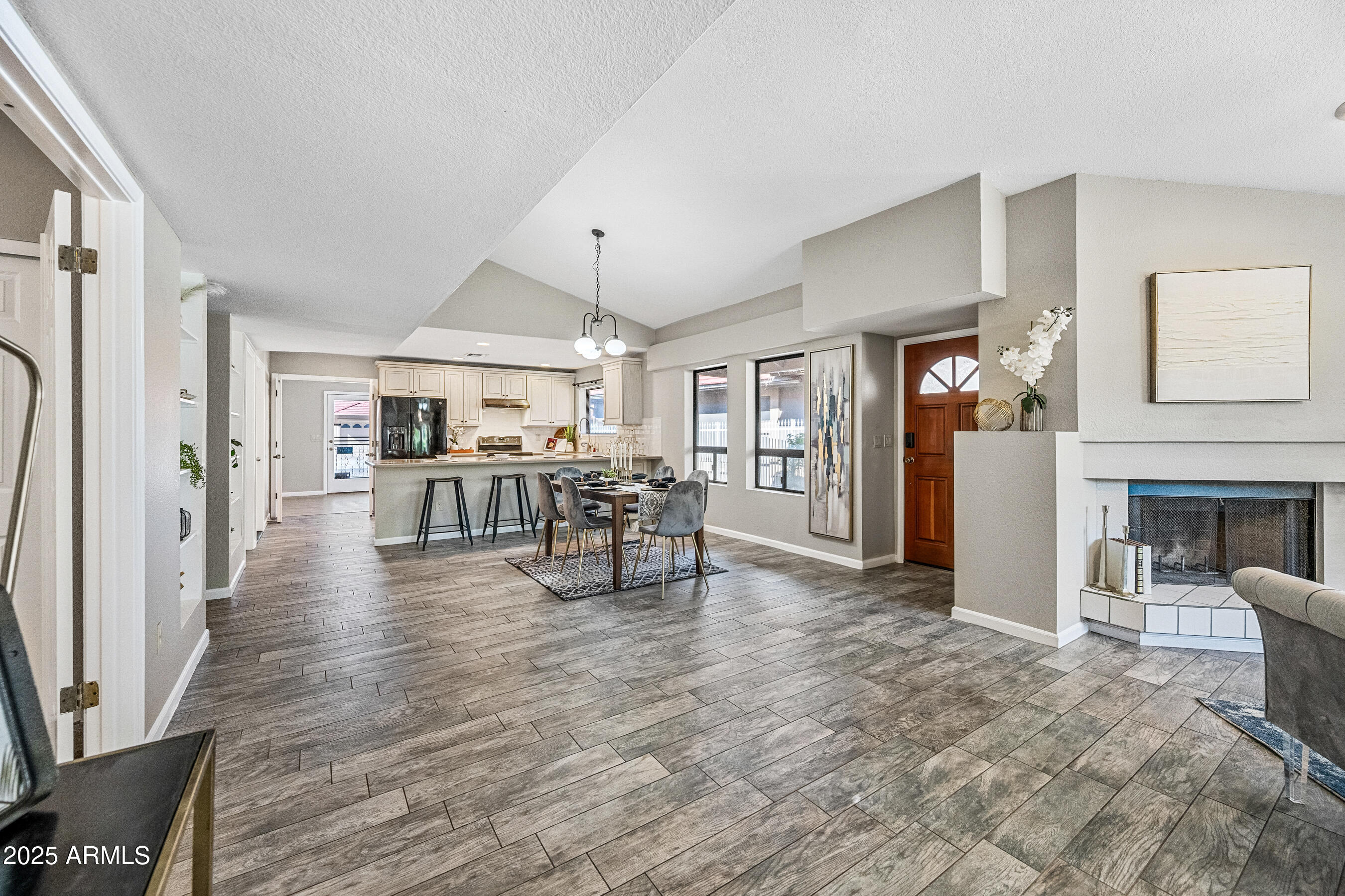 5751 West Del Rio Street Chandler, AZ 85226 - Photo 9 of 44 a dining room with furniture and wooden floor