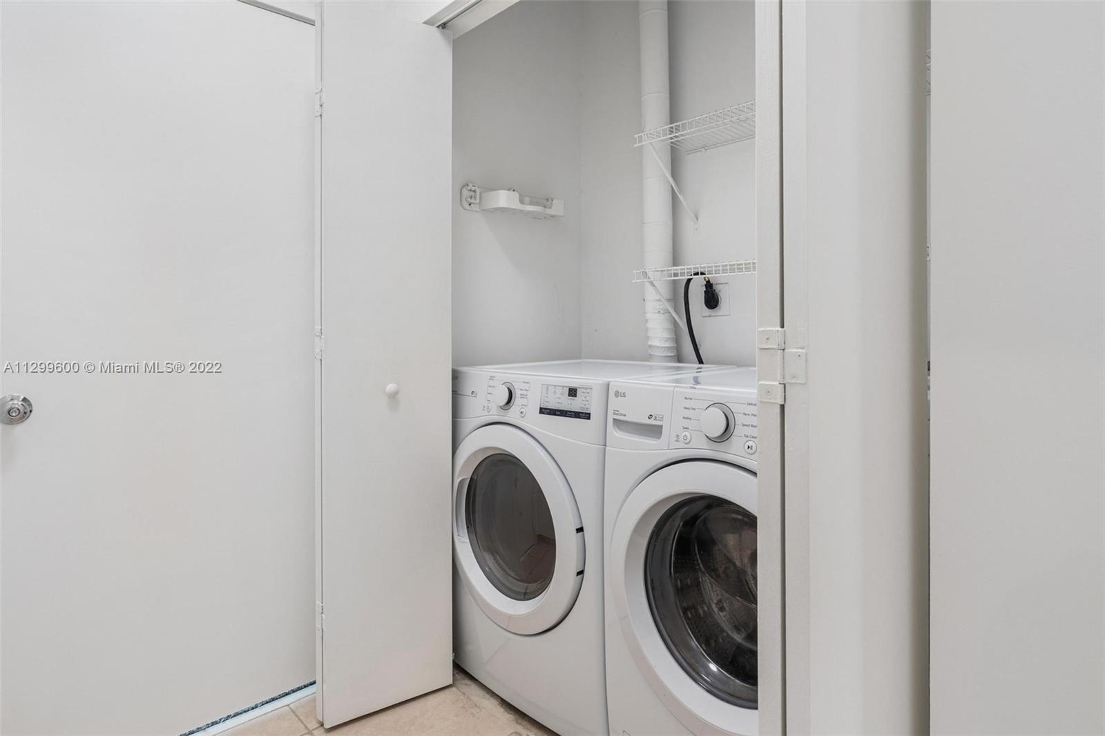 2001 Biscayne Boulevard, Unit 2308 Miami, FL 33137 - Photo 13 of 17 a utility room with dryer and washer
