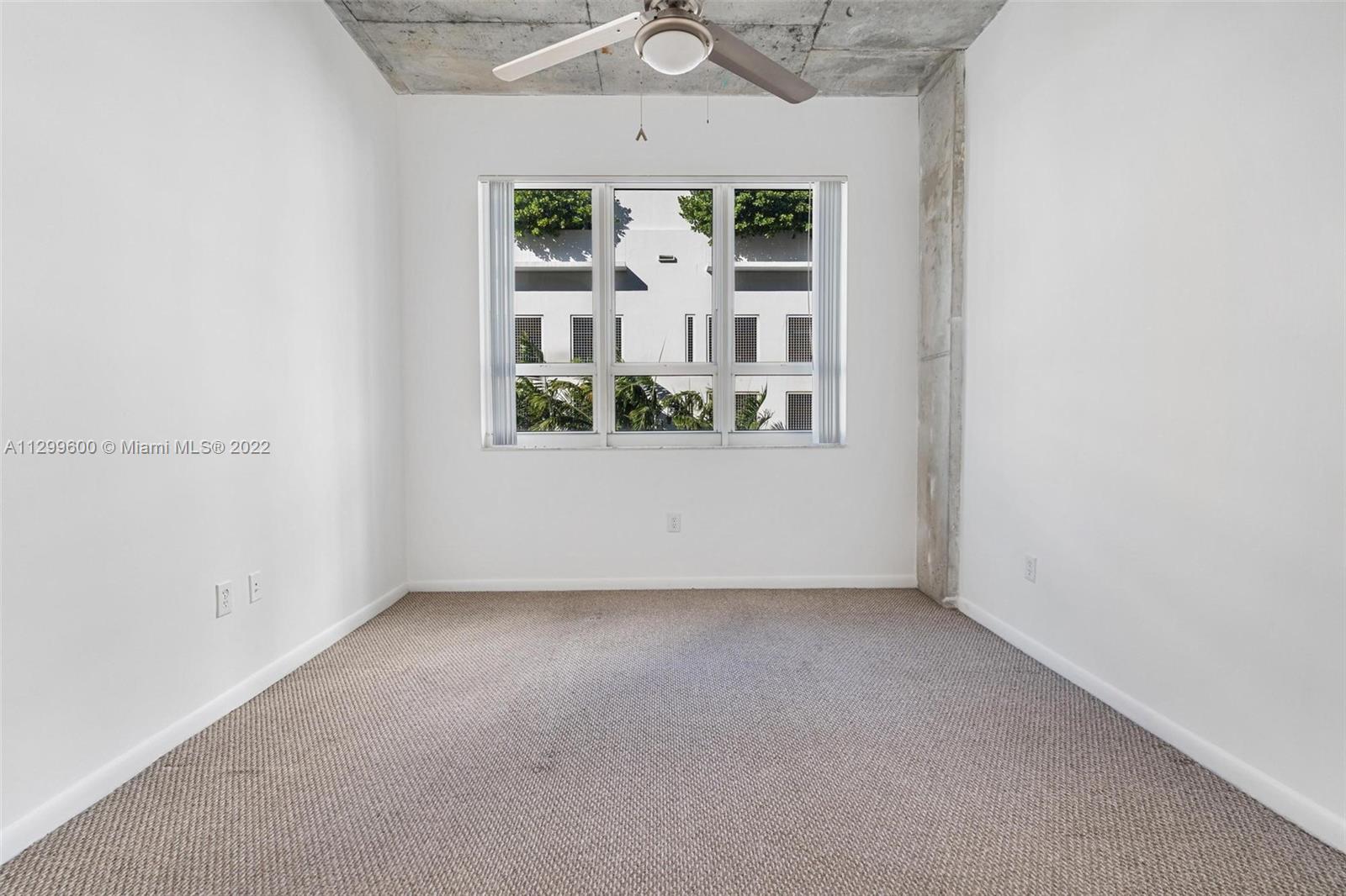 2001 Biscayne Boulevard, Unit 2308 Miami, FL 33137 - Photo 7 of 17 an empty room with windows and entrance