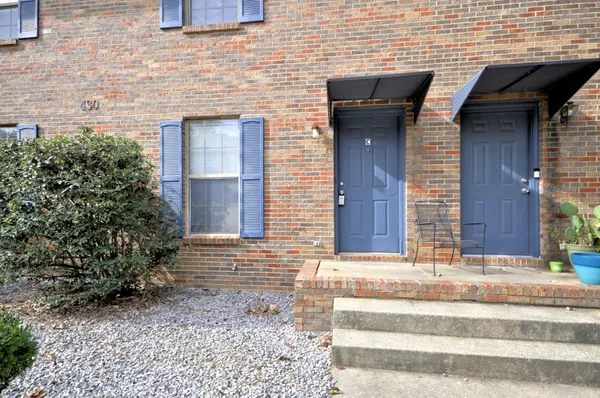 a view of brick house with a large windows