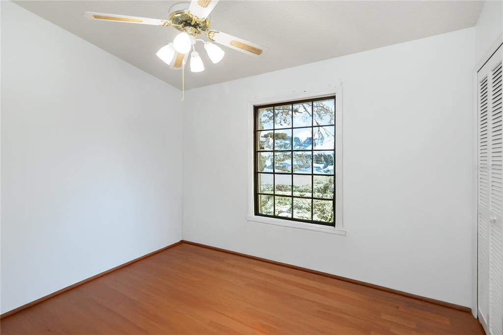 4207 Hamilton Court St. Cloud, FL 34769 - Photo 18 of 30 an empty room with a window and a fan