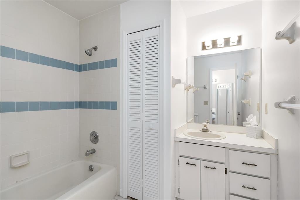 4207 Hamilton Court St. Cloud, FL 34769 - Photo 23 of 30 a bathroom with a double vanity sink mirror and bathtub