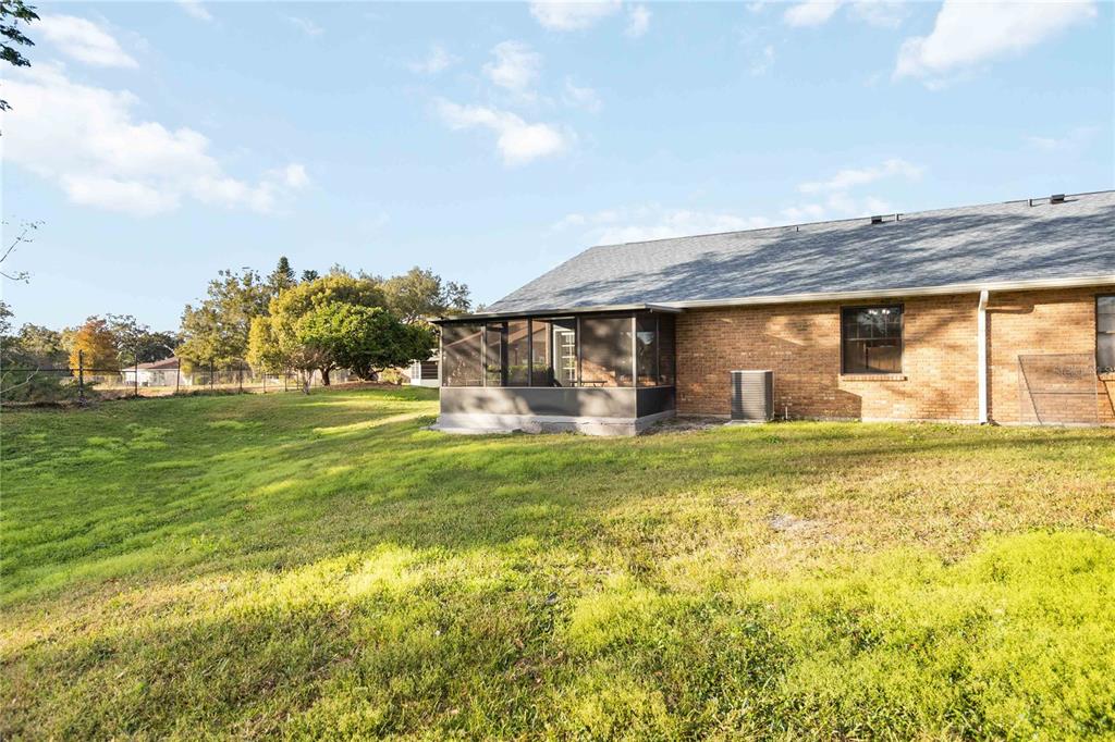 4207 Hamilton Court St. Cloud, FL 34769 - Photo 27 of 30 a front view of house with an outdoor space and seating