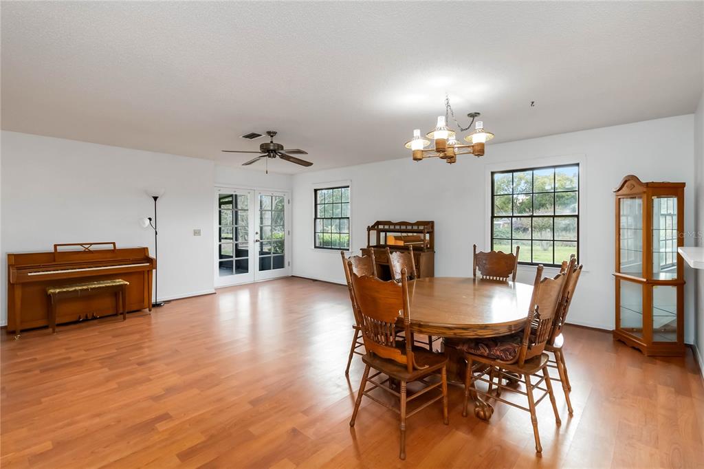 4207 Hamilton Court St. Cloud, FL 34769 - Photo 5 of 30 a view of a dining room with furniture window and wooden floor
