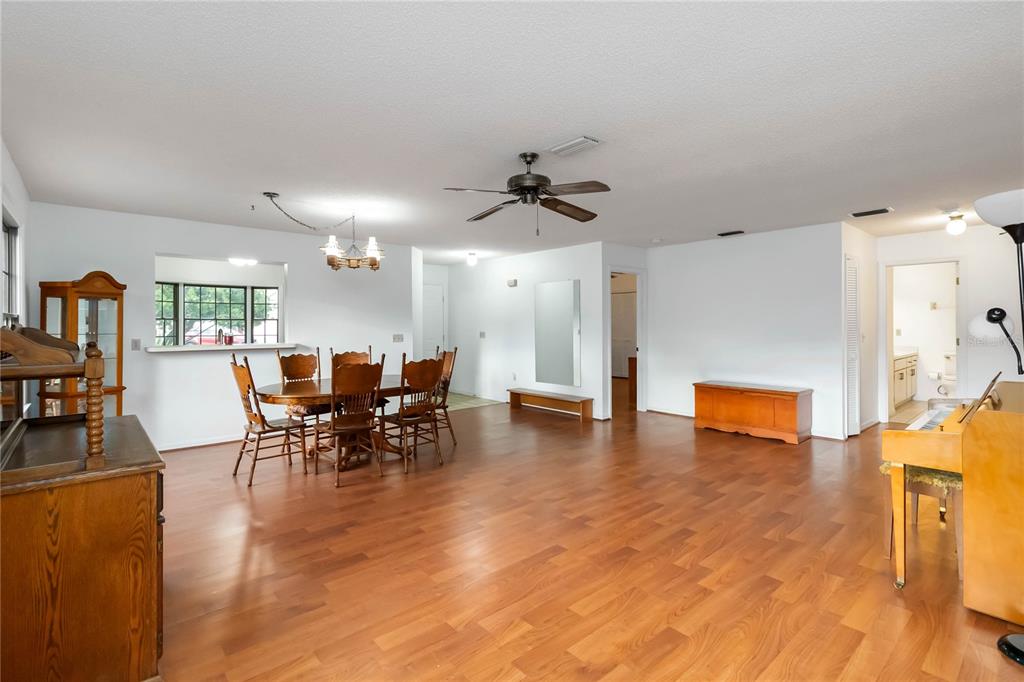 4207 Hamilton Court St. Cloud, FL 34769 - Photo 6 of 30 a view of a dining room with furniture and chandelier