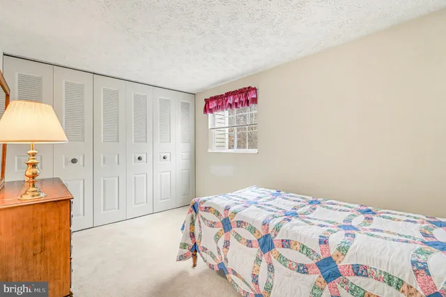 a bedroom with a bed and a cabinets