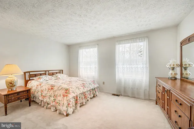 a bedroom with a bed and a cabinets
