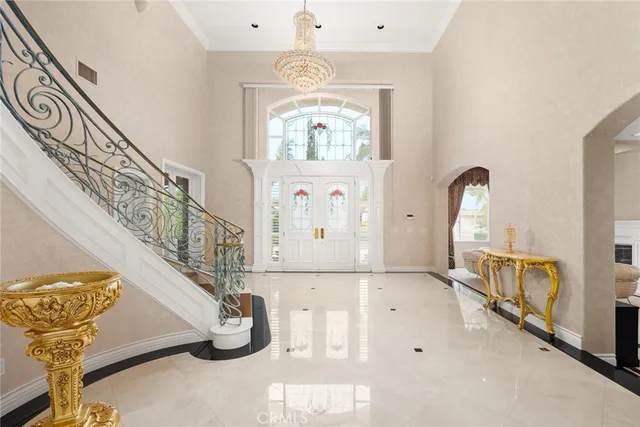 a bedroom with a large bed and a fireplace