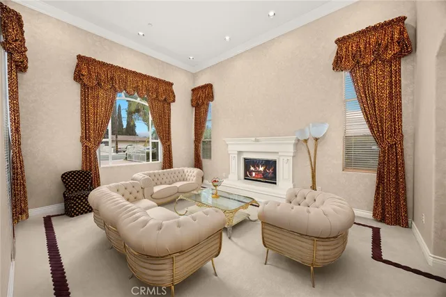 a dining room with furniture a chandelier and window