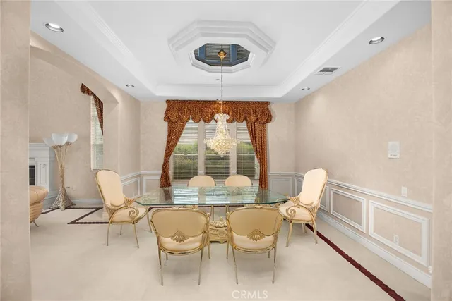 a living room with furniture fireplace and wooden floor