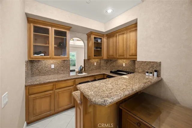 a view of a dining room with furniture and windows