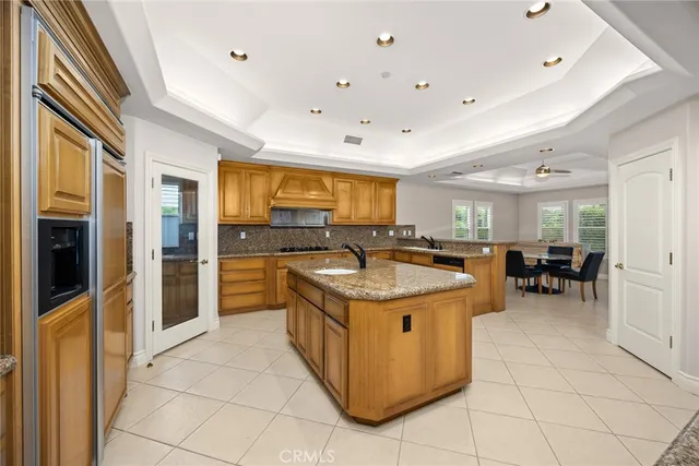 a view of a dining room with furniture and a large window
