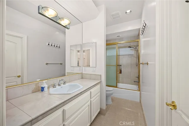 a large white kitchen with a large window