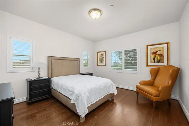 an aerial view of a house with a yard and lake view