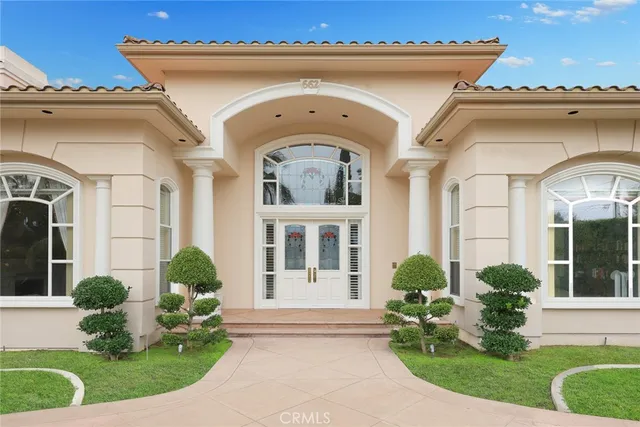 a kitchen with a sink a stove and cabinets