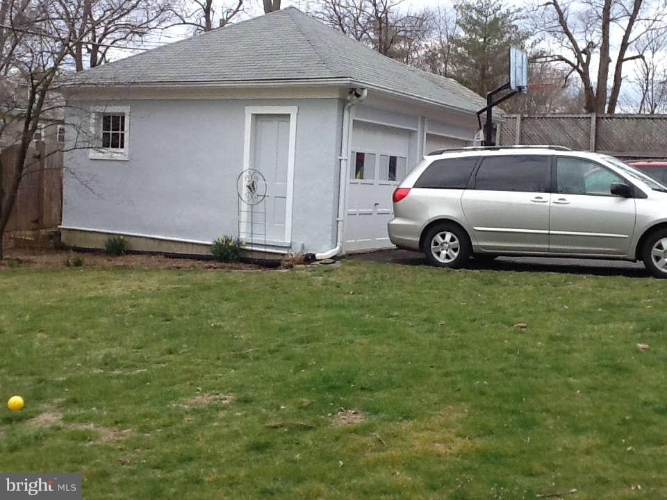 1205 Frederick Road Baltimore, MD 21228 - Photo 9 of 30 a view of a car parked in front of a house