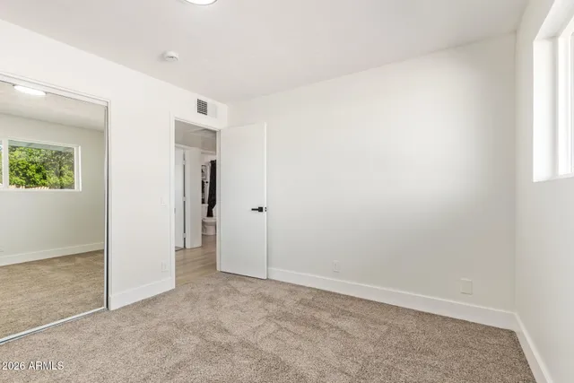 an empty room with windows