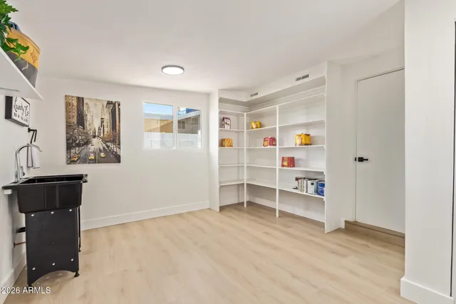 an empty room with shelves