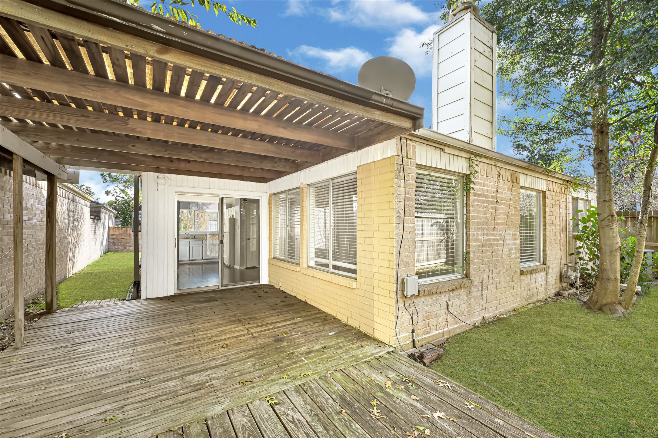 18562 Meadows Way Drive Houston, TX 77084 - Photo 7 of 11 a view of a porch with wooden floor and roof