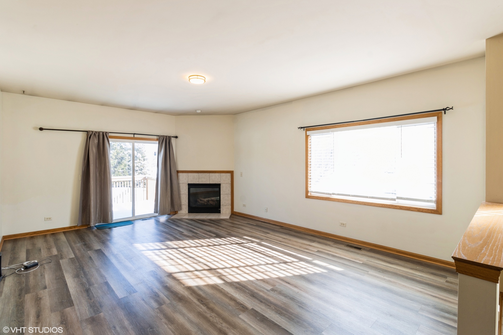 1326 Dancing Bear Lane Elgin, IL 60120 - Photo 11 of 28 a view of an empty room with wooden floor and a window