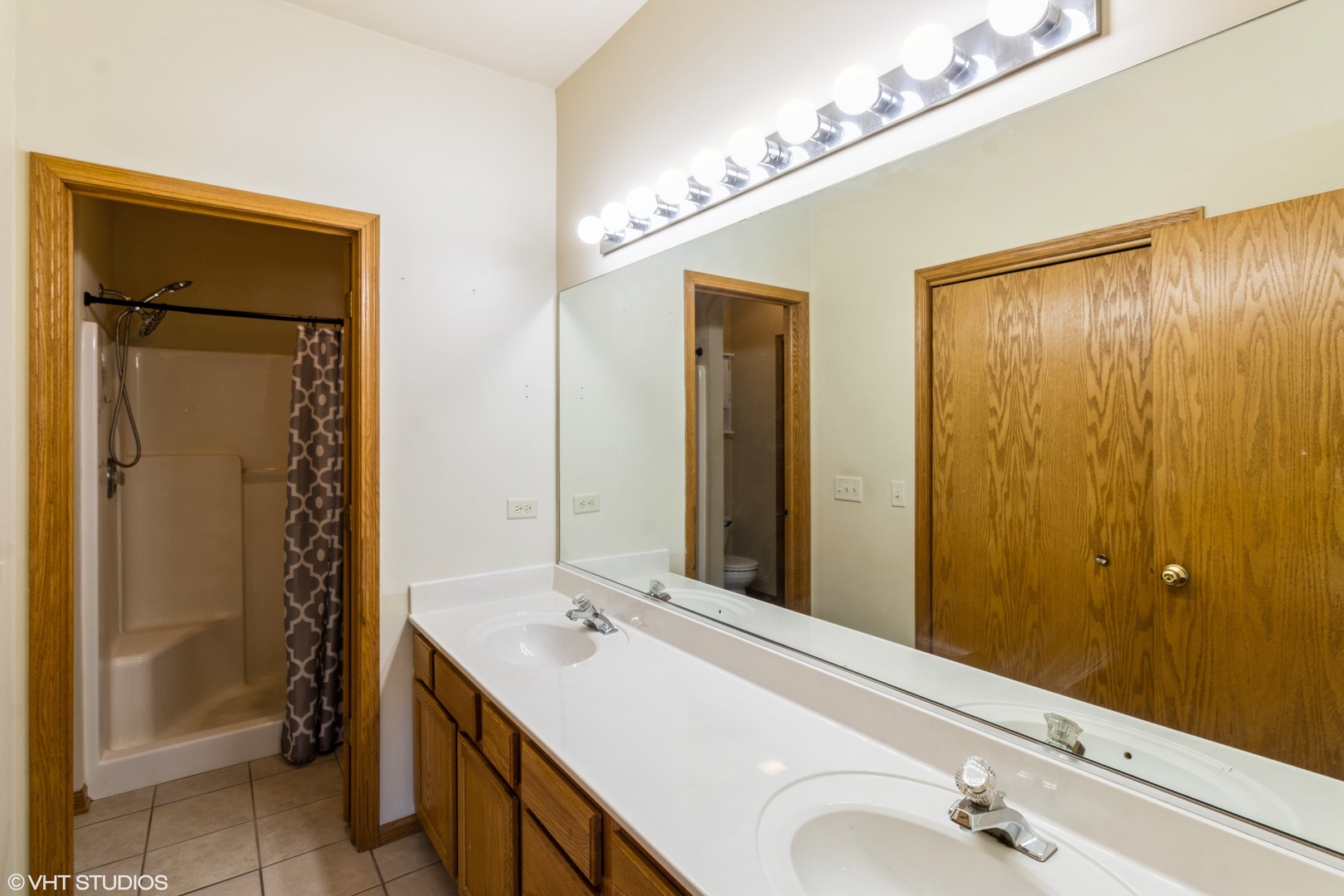 1326 Dancing Bear Lane Elgin, IL 60120 - Photo 18 of 28 a bathroom with a double vanity sink and a mirror