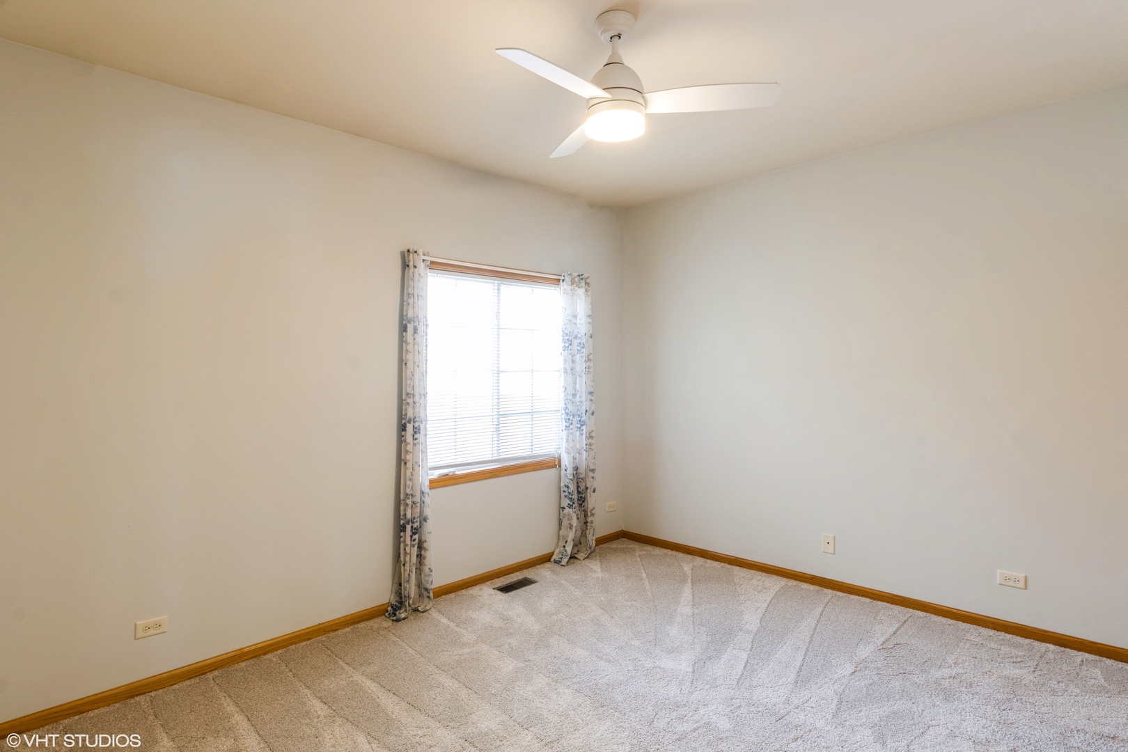 1326 Dancing Bear Lane Elgin, IL 60120 - Photo 19 of 28 an empty room with chandelier fan and windows