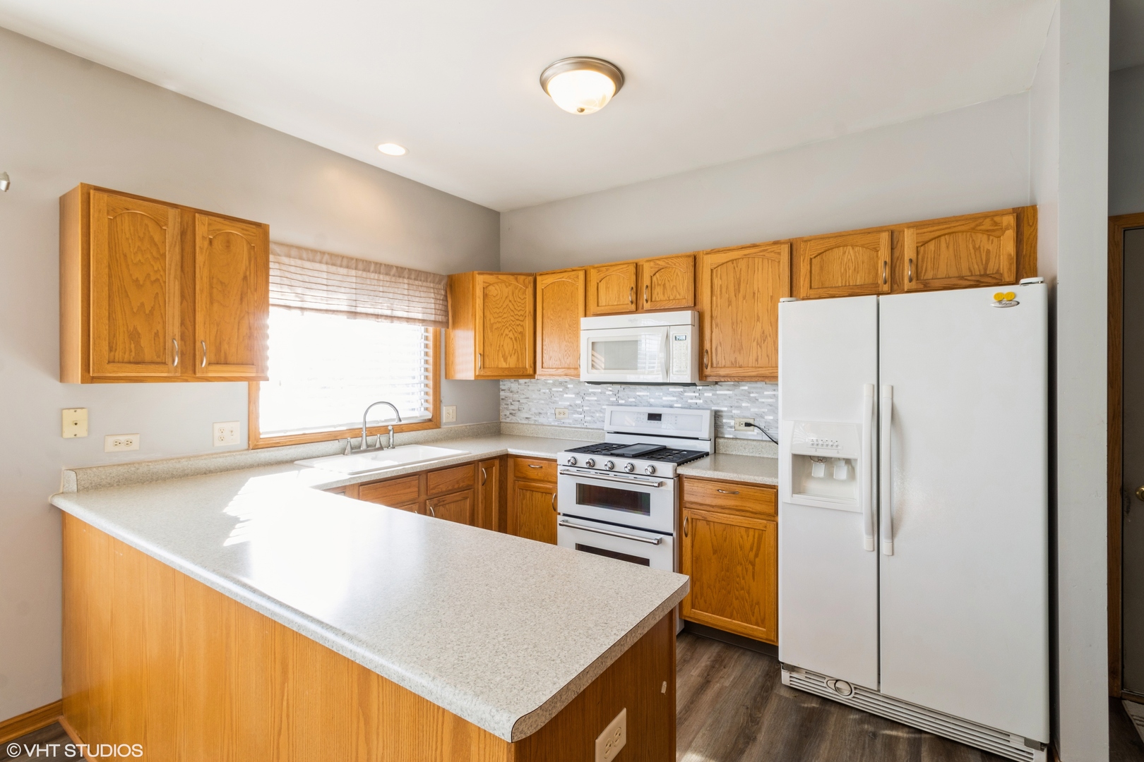 1326 Dancing Bear Lane Elgin, IL 60120 - Photo 5 of 28 a kitchen with a refrigerator a stove a sink and a window