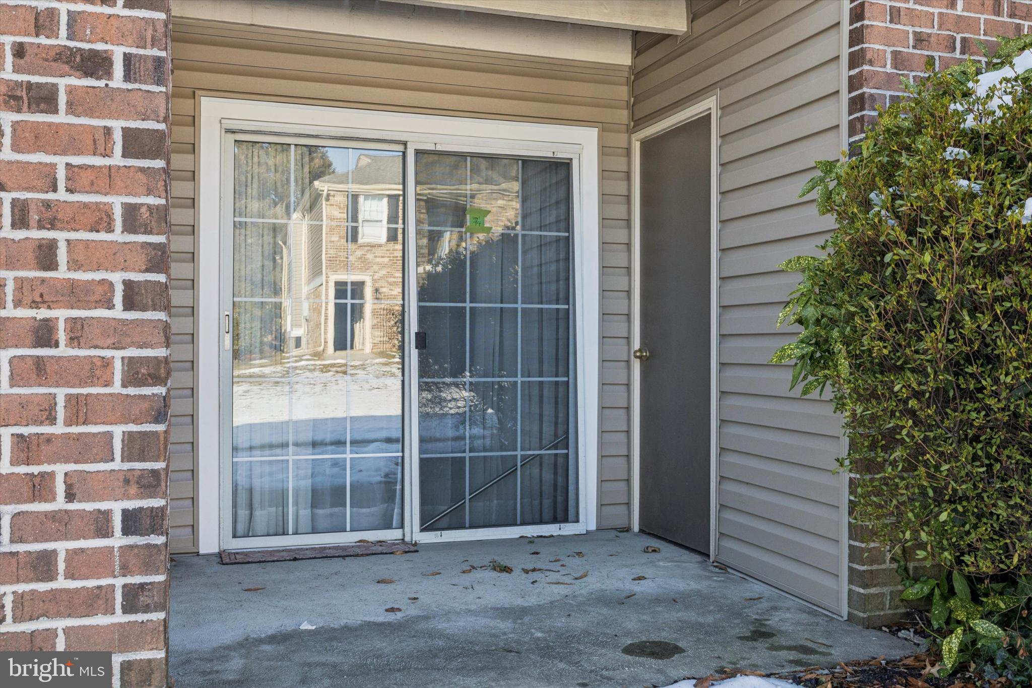94 Ramsgate Court, Unit 210 U94 Blue Bell, PA 19422 - Photo 2 of 24 Patio with storage closet and garden