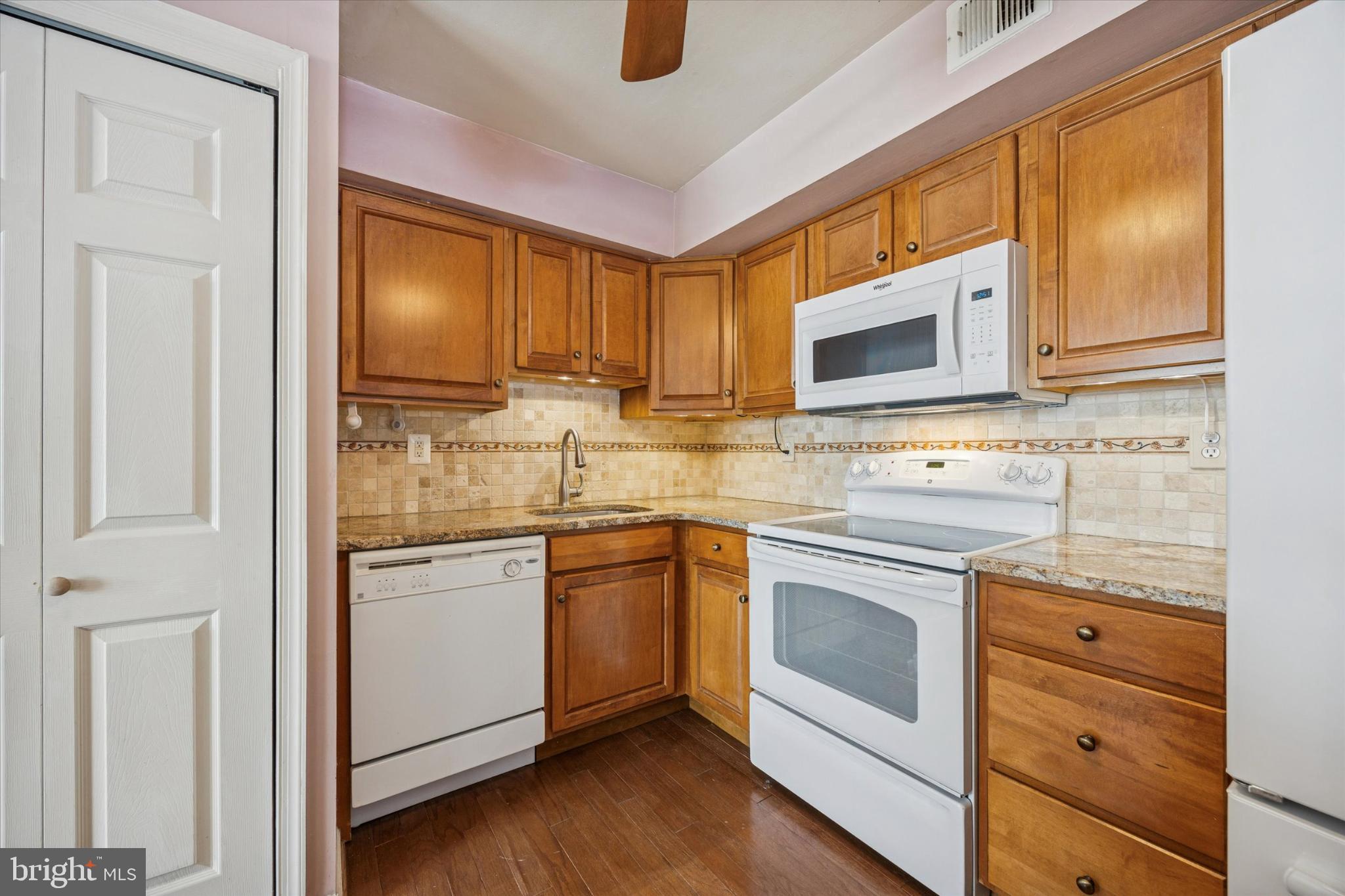94 Ramsgate Court, Unit 210 U94 Blue Bell, PA 19422 - Photo 8 of 24 Renovated kitchen with hidden laundry area