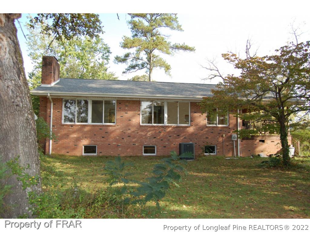 179 Briggs Road Cameron, NC 28326 - Photo 4 of 20 a front view of a house with a garden