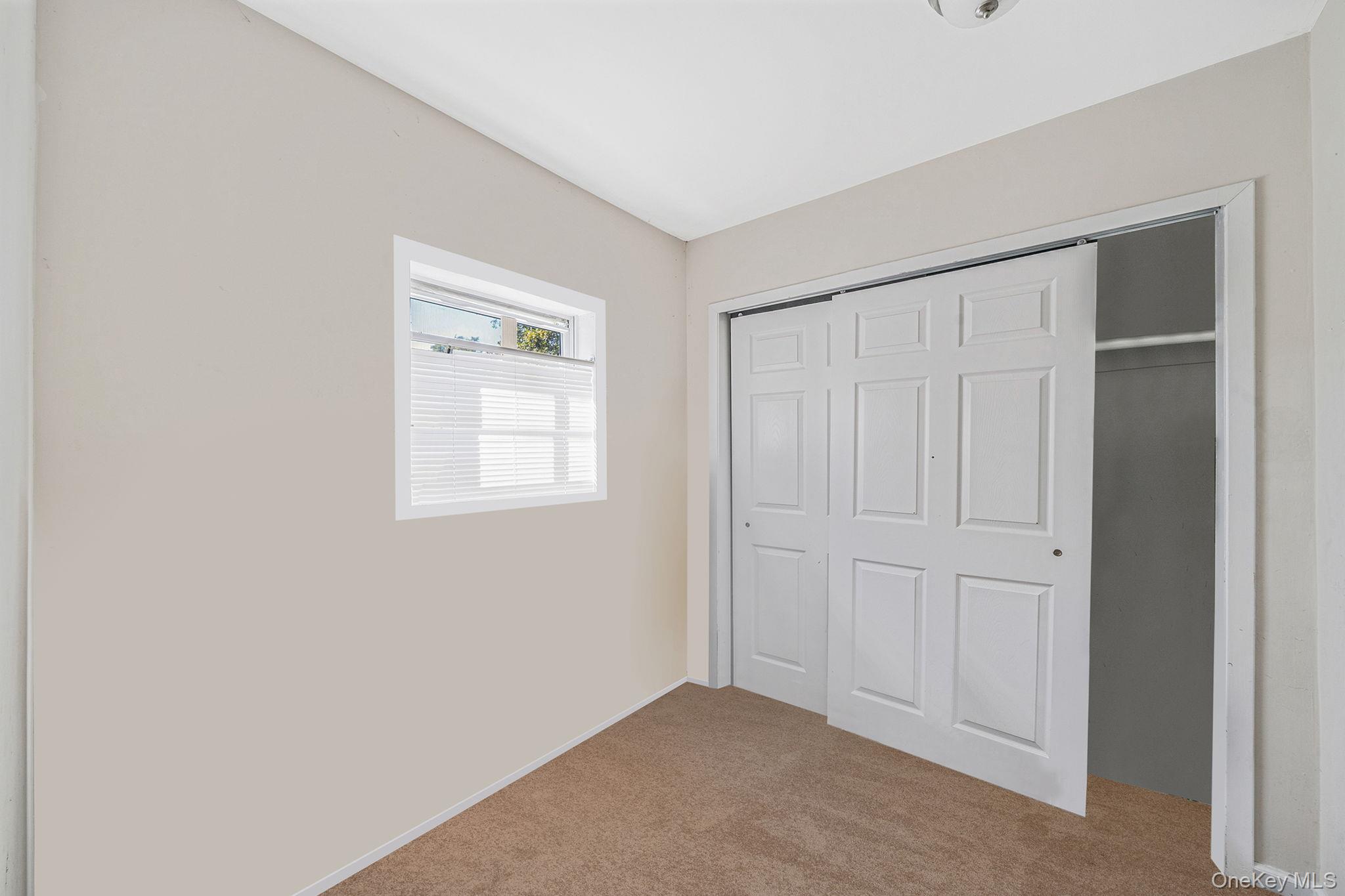 15 Sayville Road Mastic Beach, NY 11951 - Photo 15 of 25 a view of an empty room with closet area
