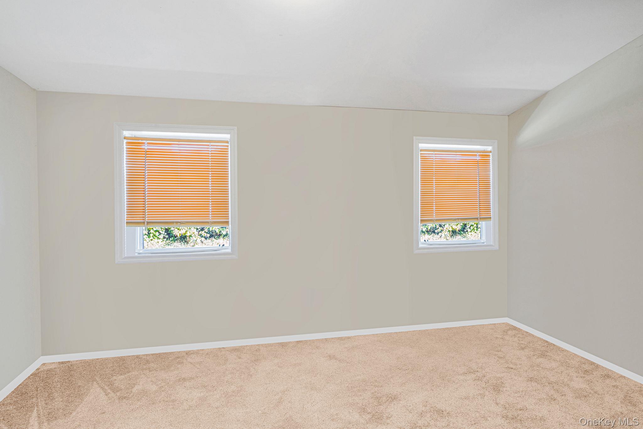 15 Sayville Road Mastic Beach, NY 11951 - Photo 16 of 25 an empty room with a window